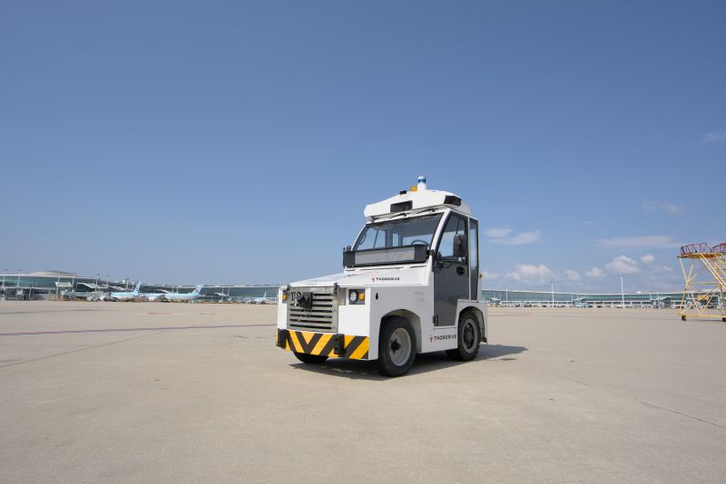 ThorDrive autonomous cargo tractor on an airport apron